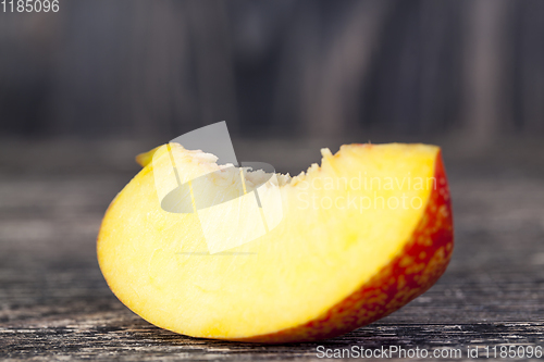 Image of one fresh slice of ripe peach