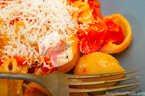 Image of Italian snail lumaconi pasta with tomatoes