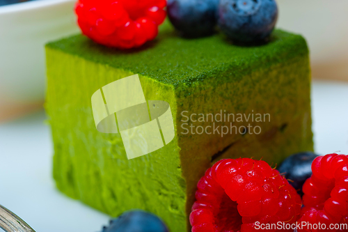 Image of green tea matcha mousse cake with berries