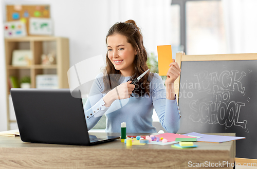 Image of teacher having online class of arts and crafts