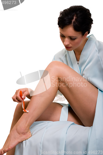 Image of Woman shaving legs