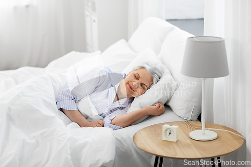 Image of senior woman sleeping in bed at home bedroom