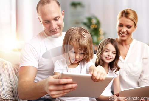 Image of happy family with tablet pc computers at home