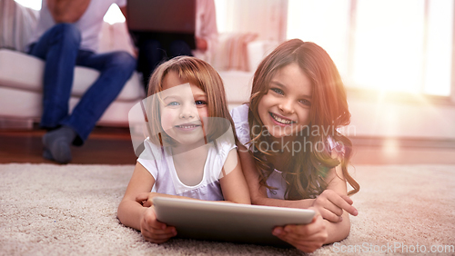 Image of happy little girls with tablet pc computer at home