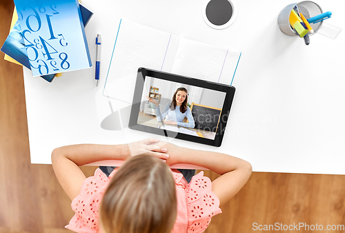 Image of girl with tablet pc having online class at home