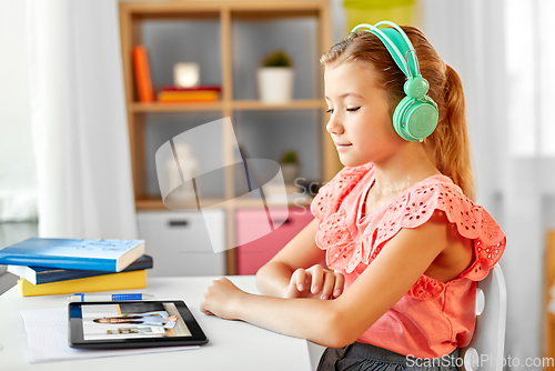 Image of girl with tablet pc having online class at home