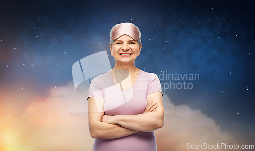 Image of senior woman in pajamas and eye sleeping mask