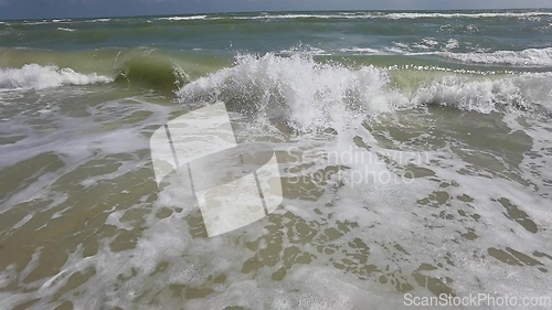 Image of Powerful ocean waves crashing on a coast. Extreme stormy ocean waves splashing on a Beach