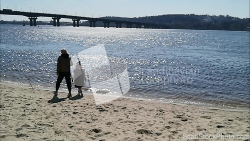 Image of Child and Mother walking along the Shore, Dnepr River.