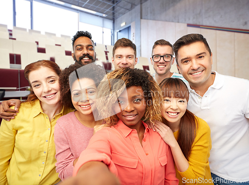 Image of international students and teacher taking selfie