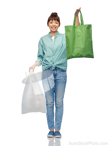 Image of woman with plastic and reusable shopping bag