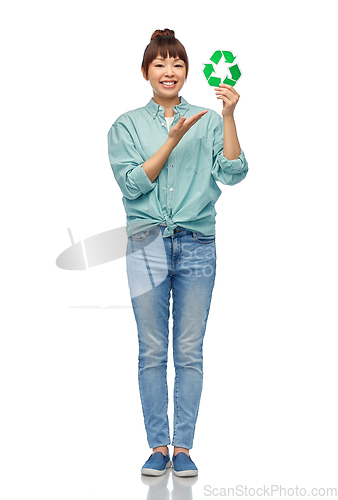 Image of smiling asian woman holding green recycling sign