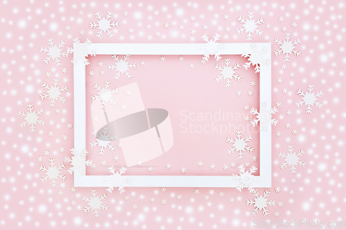 Image of Christmas Abstract Snowflake and Snow Pink Background Border