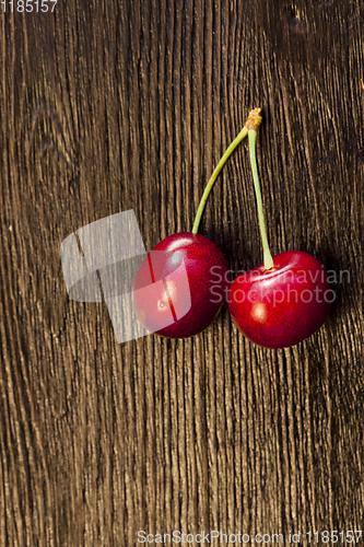 Image of two connected red cherries