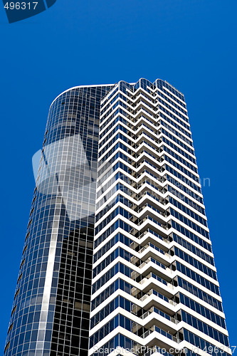 Image of apartment building against blue sky