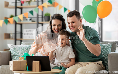 Image of family with tablet pc has video call on birthday