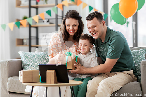 Image of family with tablet pc has video call on birthday