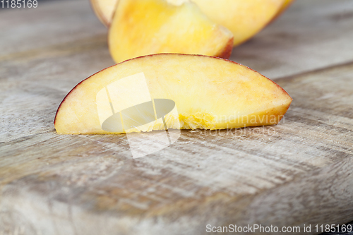 Image of cut into pieces ripe peach