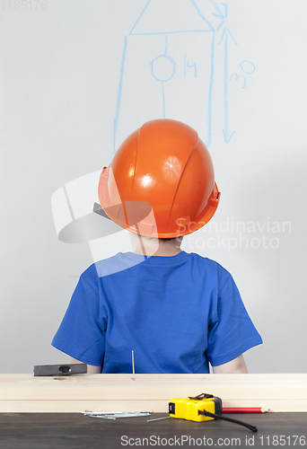 Image of boy in an orange helmet