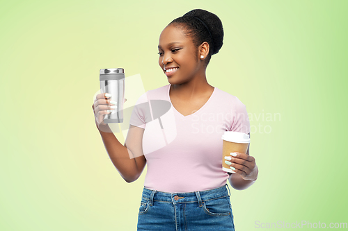 Image of woman with coffee cup and tumbler for hot drinks