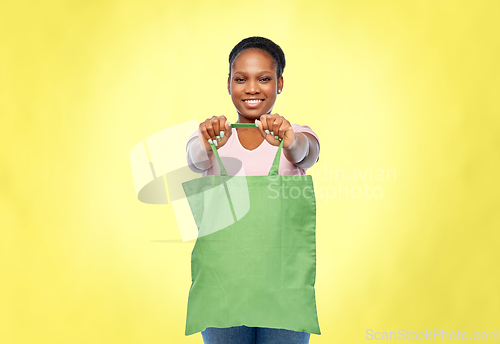 Image of woman with reusable canvas bag for food shopping