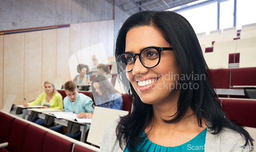 Image of happy smiling young indian woman in glasses