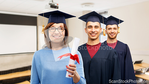 Image of happy graduate students woman with diploma