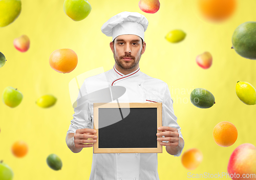 Image of male chef showing chalkboard