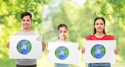 Image of smiling children holding drawing of earth planet