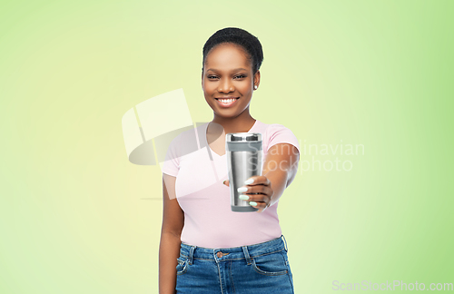 Image of woman with thermo cup or tumbler for hot drinks