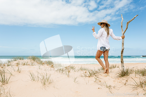 Image of Woman on pristine seculuded beach Australia good vibes