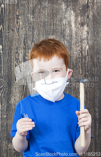Image of boy and construction tools