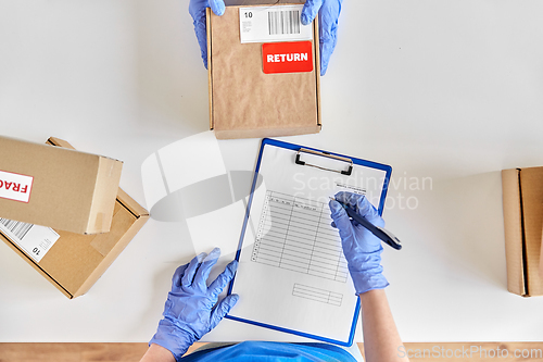 Image of customer making return of parcel or purchase