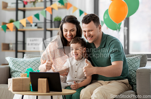 Image of family with tablet pc has video call on birthday