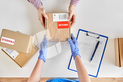 Image of customer making return of parcel or purchase