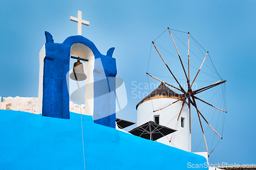 Image of Old greek windmill on Santorini island in Oia town with stairs in street. Santorini, Greece