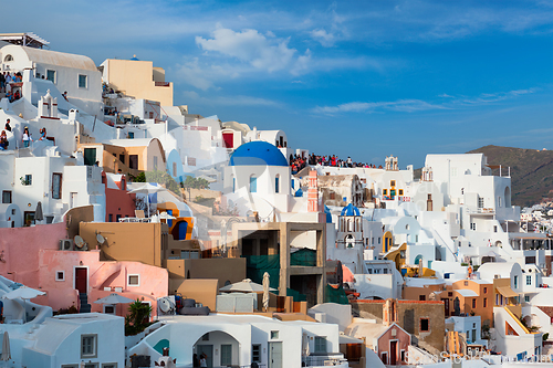 Image of Tourist crowd in a viewpoint in Oia Village, Santorini island, Greece