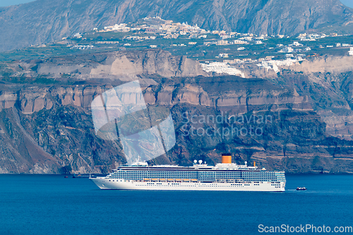 Image of Cruise liner ship vessel in Aegean sea near Santorini island. Oia Fira village Santorini, Greece