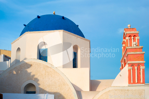 Image of Famous view from viewpoint of Santorini Oia village with blue dome of greek orthodox Christian church