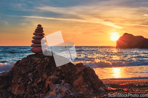 Image of Concept of balance and harmony - stone stack on the beach