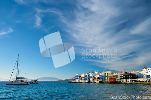 Image of Sunset in Mykonos, Greece, with cruise ship and yachts in the harbor