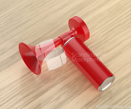 Image of Air horn on wooden table
