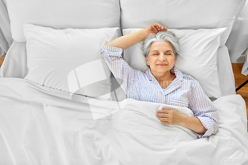 Image of senior woman sleeping in bed at home bedroom