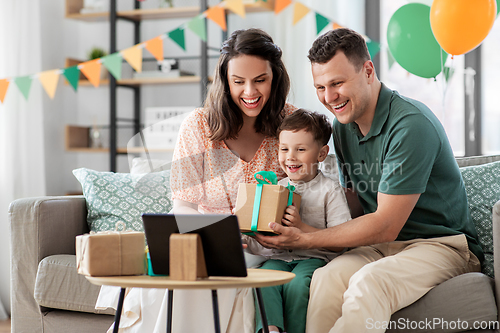 Image of family with tablet pc has video call on birthday