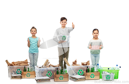 Image of children l sorting paper, metal and plastic waste