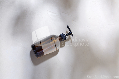 Image of bottle of shower gel or liquid soap with dispenser