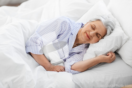 Image of senior woman sleeping in bed at home bedroom