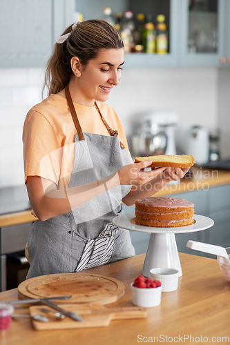 Image of woman cooking food and baking on kitchen at home