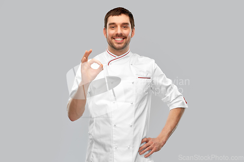 Image of happy smiling male chef showing ok hand sign