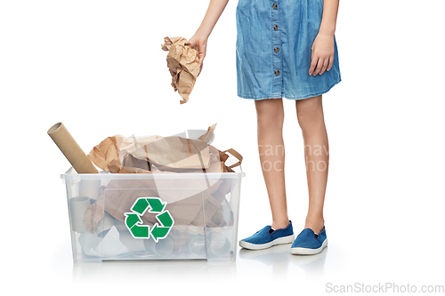 Image of girl sorting paper waste